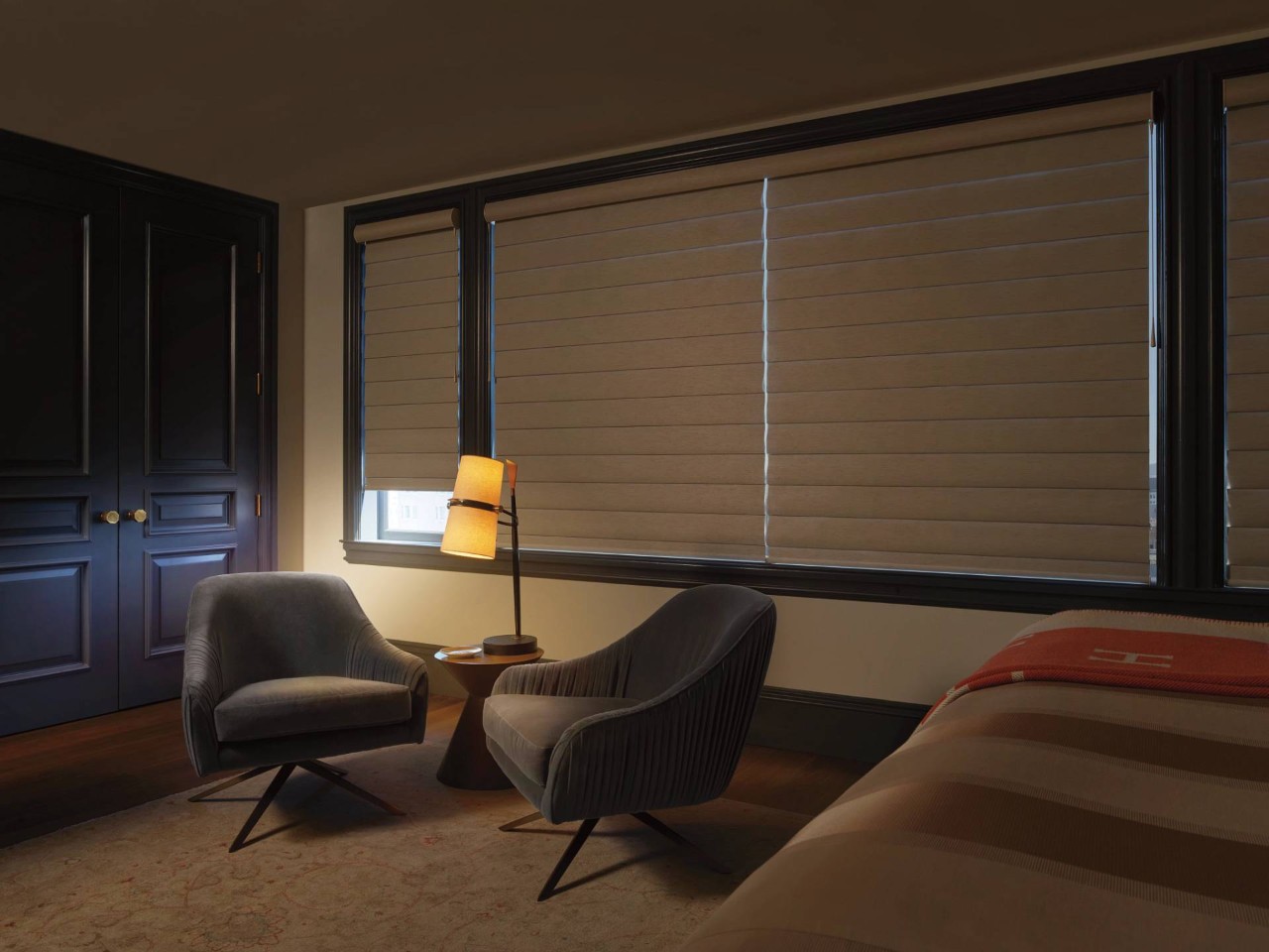 Bedroom with large window decorated with Hunter Douglas Pirouette® Window Shadings near Cambridge, MD