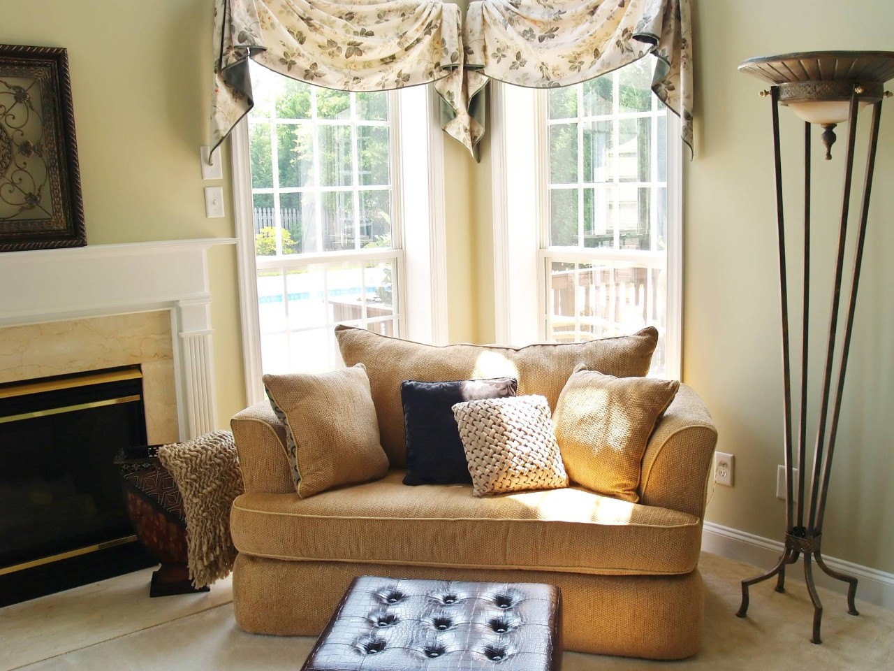 Custom floral valances on two tall windows in the corner of a traditional living room at Hubbard's Custom Blinds near Cambridge, Maryland (MD)